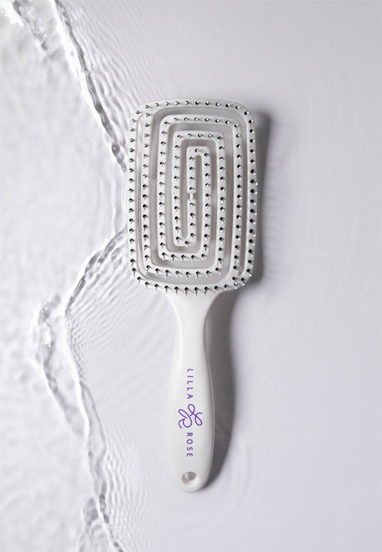 Flexi Brush has a curved comb shape with a flexible body