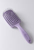 Flexi Brush has a curved comb shape with a flexible body