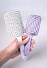 Flexi Brush has a curved comb shape with a flexible body