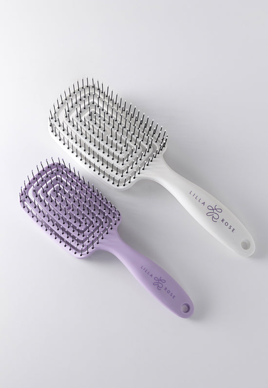 Flexi Brush has a curved comb shape with a flexible body