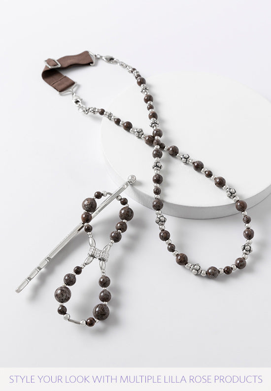 Unique curved pin design is made with natural brown snowflake jasper.