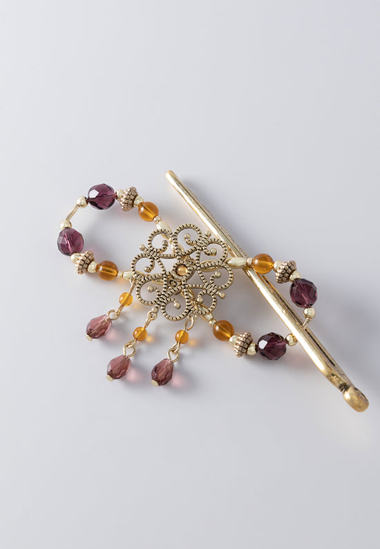 Flexi with filigree center with drops of amethyst and topaz.