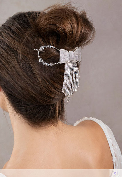 Flexi hair clip with blingy bow with long crystal strands in brown hair