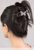 Flexi with butterfly and delicately detailed wings and lavender and purple pearls in black hair