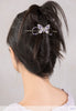 Flexi with butterfly and delicately detailed wings and lavender and purple pearls in black hair