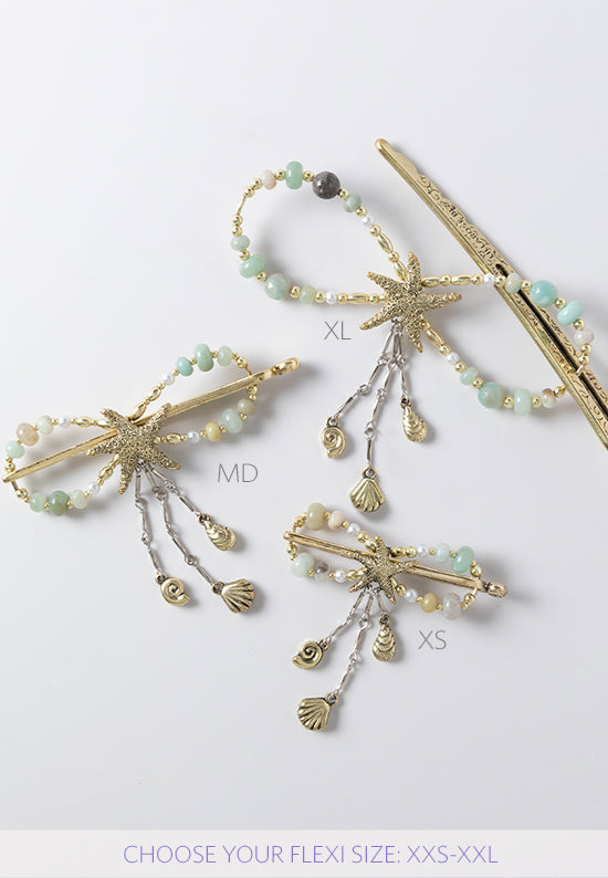 Stella flexi clip in brasstone features a sea star with seashell dangles and a combination of amazonite stone and glass pearl accents.