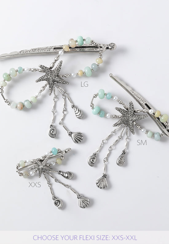 Stella flexi clip in silvertone features a sea star with seashell dangles and a combination of amazonite stone and glass pearl accents.