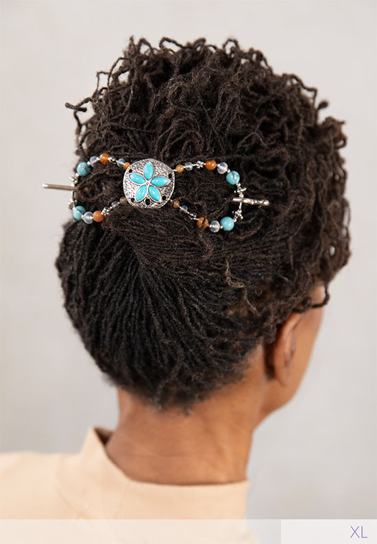 Sandra Flexi features a stunning sand dollar with a mix of turquoise and matte opal aurora borealis beads and natural pink lepidolite stones. 