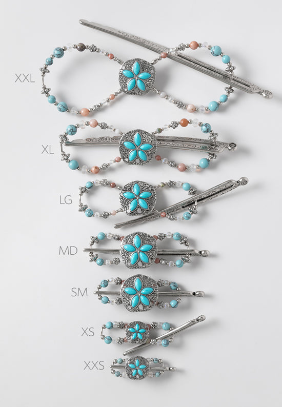 Sandra flexi clip features a stunning sand dollar with a mix of turquoise and matte opal aurora borealis beads and natural pink lepidolite stones. Shown in all 7 sizes.
