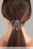 Flexi with elephant with dangles and multi-color bead accents shown in brown hair