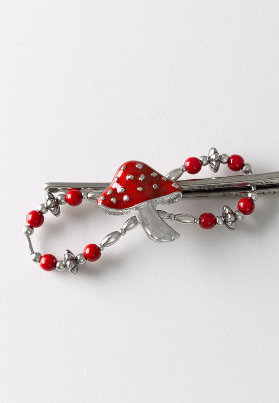 Flexi hair clip with mushroom with a bright red cap and matching beads.