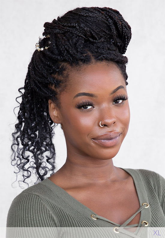 Flexi Hair Clip with pair of festive silver bells with mixed metal accents in dark braided locs