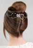 Flexi Hair Clip with pair of festive silver bells with mixed metal accents in auburn hair