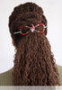 Flexi clip with christmas gnome with a long white beard and bright red hat holds a bundle of holly in brown locs