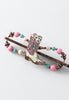 Flexi hair clip with white cowgirl boot with glittery pink and turquoise details and accents of pink, tan, turquoise and burnished coppertone.