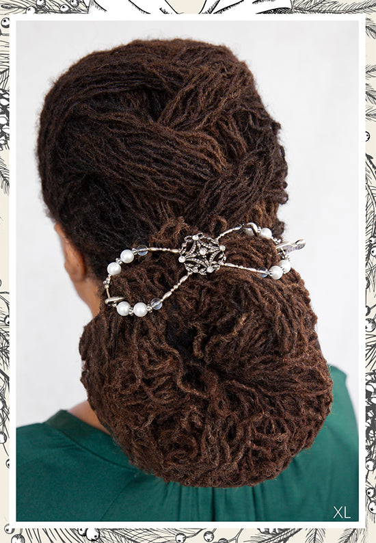 Antique wreath adorned with crystals and pearl accents shown in Sister Locs