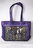 Large purple Lilla Rose bag showing off various products.