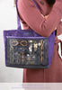 Large purple Lilla Rose bag showing off various products.