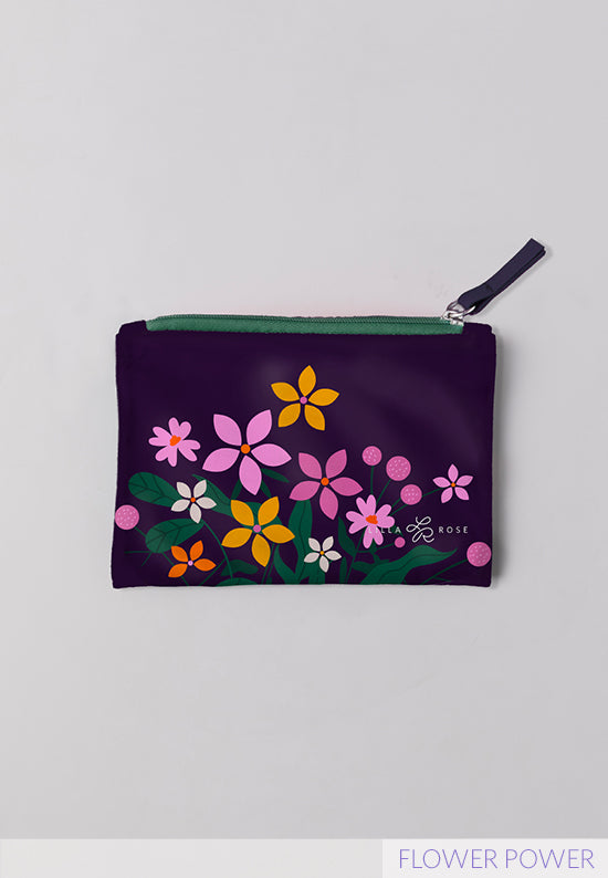 Flower Power Mane Event zipper pouch bag in purple featuring flowers in a variety of colors. 